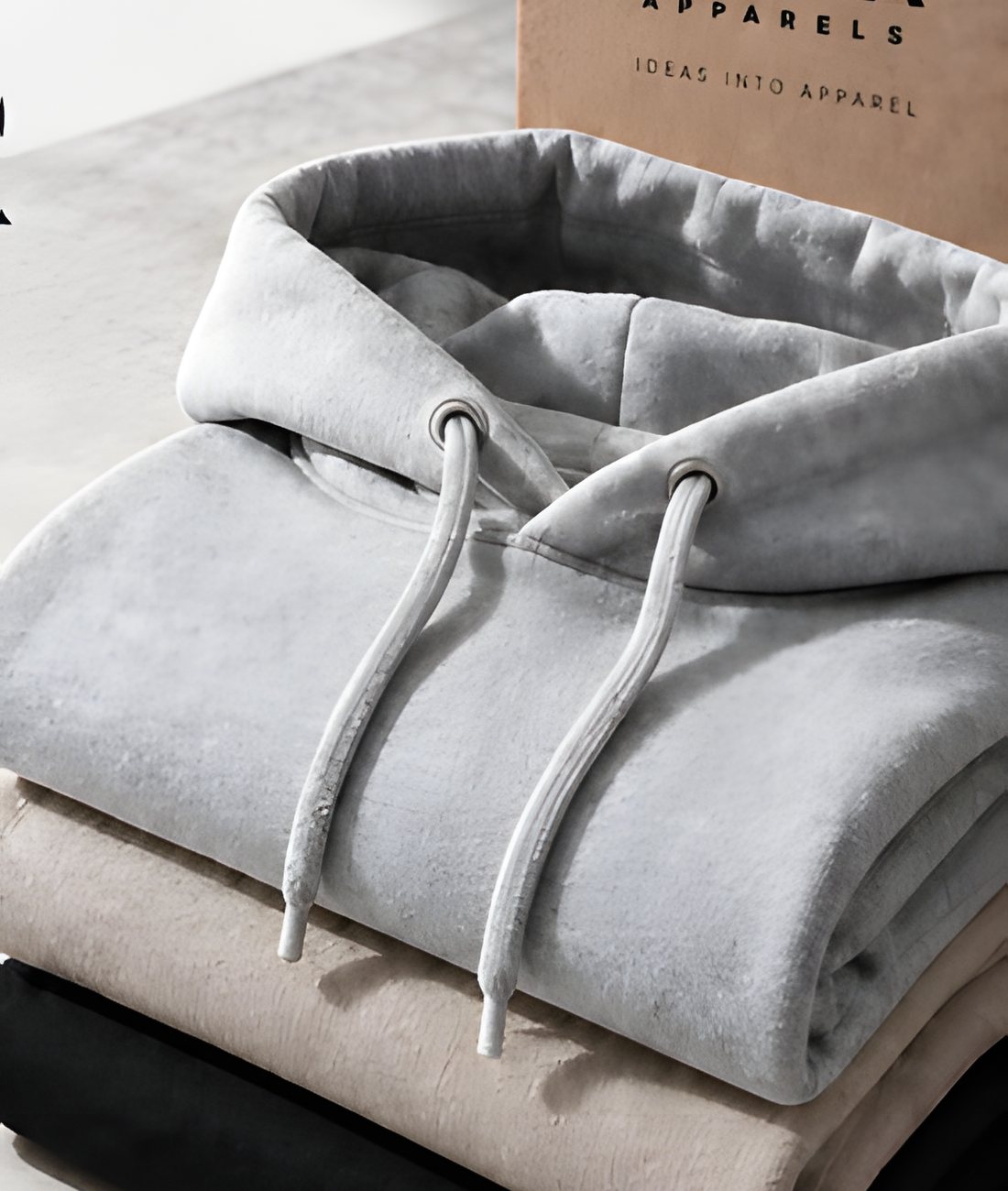 Folded hoodies with a Looma Apparels box